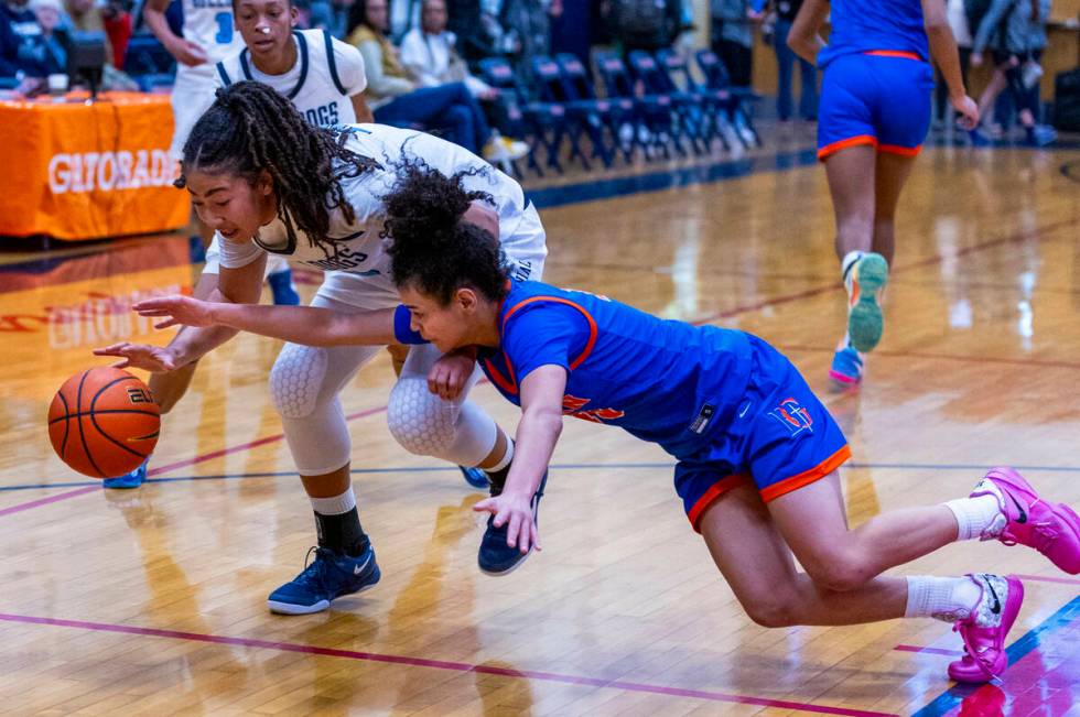 Centennial's forward Ayla Williams (12) keeps possession as Bishop Gorman's guard Aaliah Spaigh ...