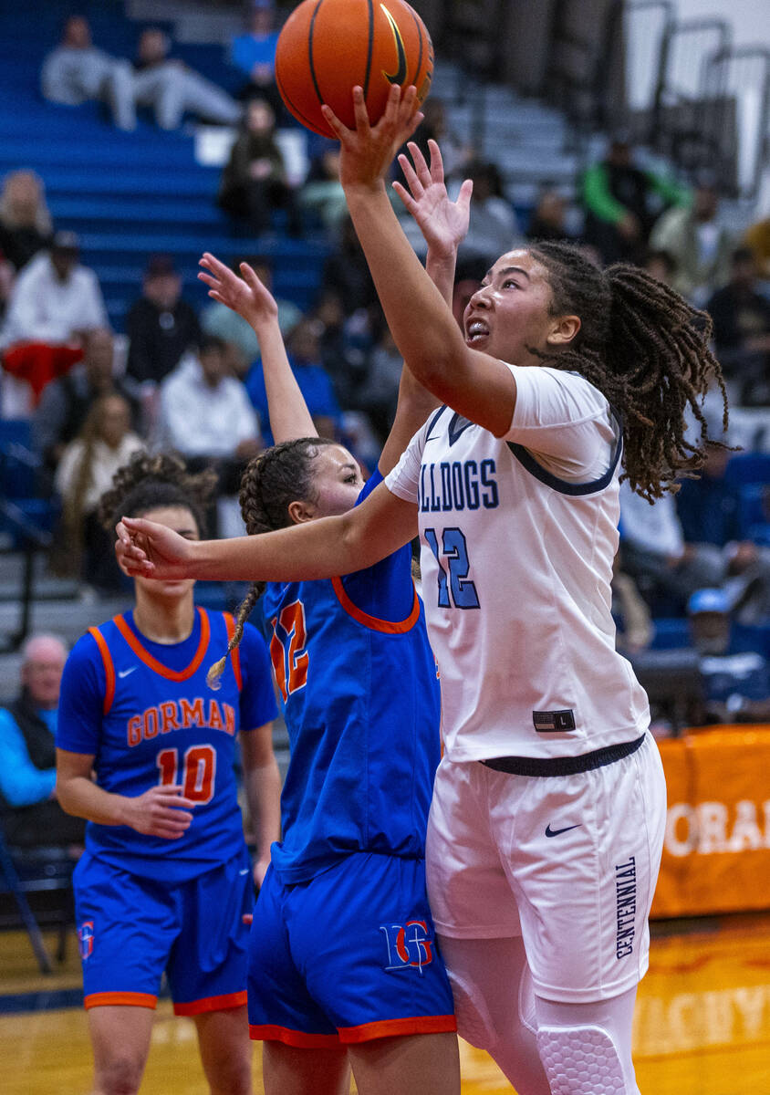 Centennial's forward Ayla Williams (12) scores against Bishop Gorman guard Addysen Carr (12) be ...