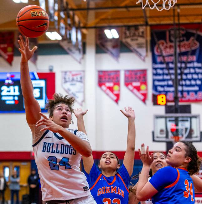 Centennial forward Nation Williams (24) scores late as Bishop Gorman guard Savannah Searcy (34) ...