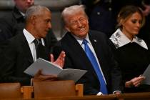 Former President Barack Obama, from left, speaks with President-elect Donald Trump as his wife ...