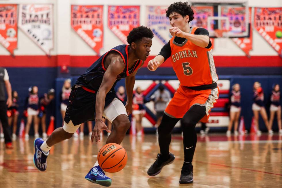 Bishop Gorman guard Dino Roberts (5) guards Coronado’s Jalen St. Clair (3) during a high ...