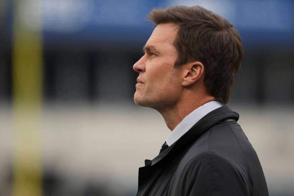 Tom Brady watches warm-ups before an NFL football game between the Philadelphia Eagles and the ...