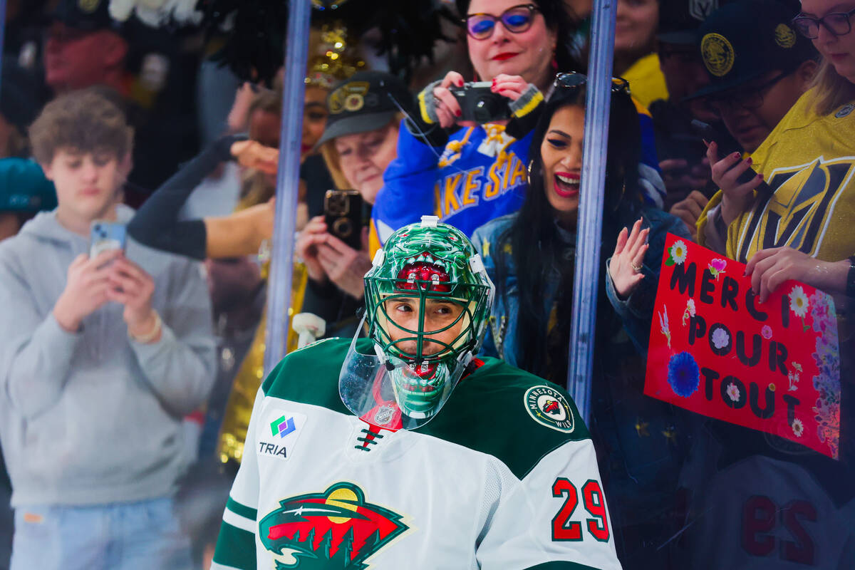 Minnesota Wild goaltender Marc-Andre Fleury (29) receives cheers from fans as he takes to the i ...