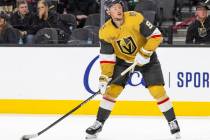 Golden Knights center Jack Eichel (9) controls the puck during the NHL hockey game against the ...