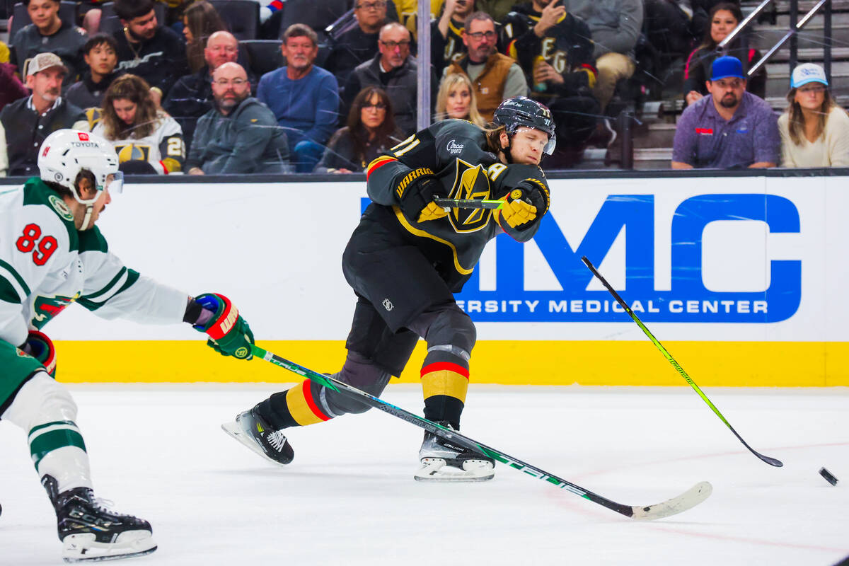 Golden Knights center William Karlsson (71) breaks his hockey stick while trying to force the p ...