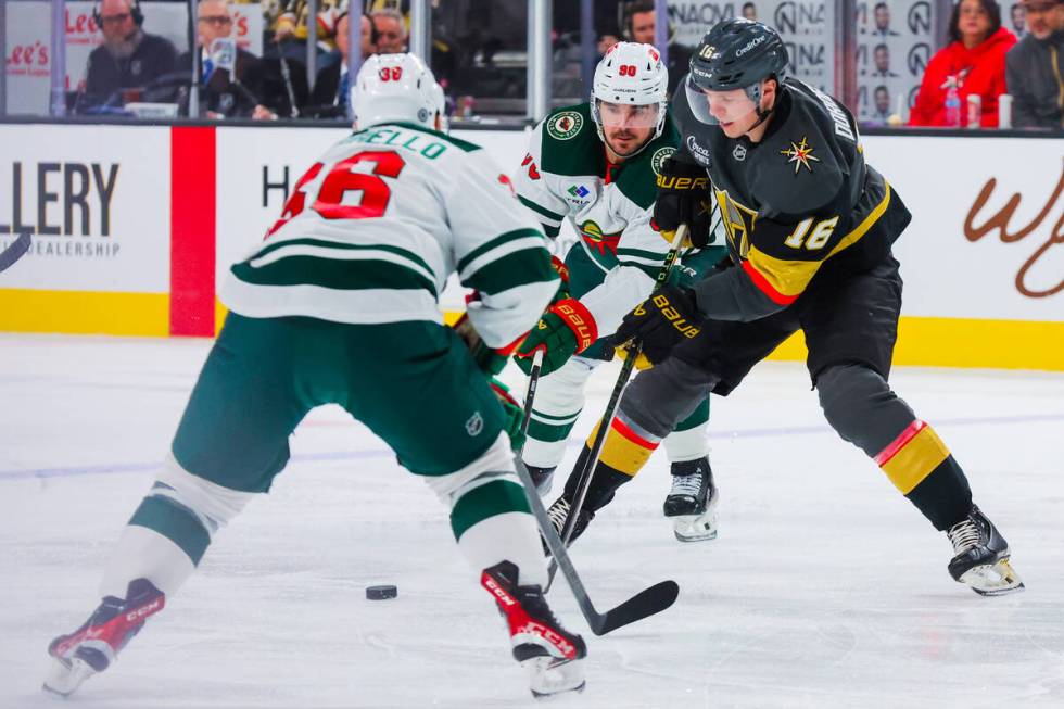 Golden Knights left wing Pavel Dorofeyev (16) skates up against Minnesota Wild center Marcus Jo ...