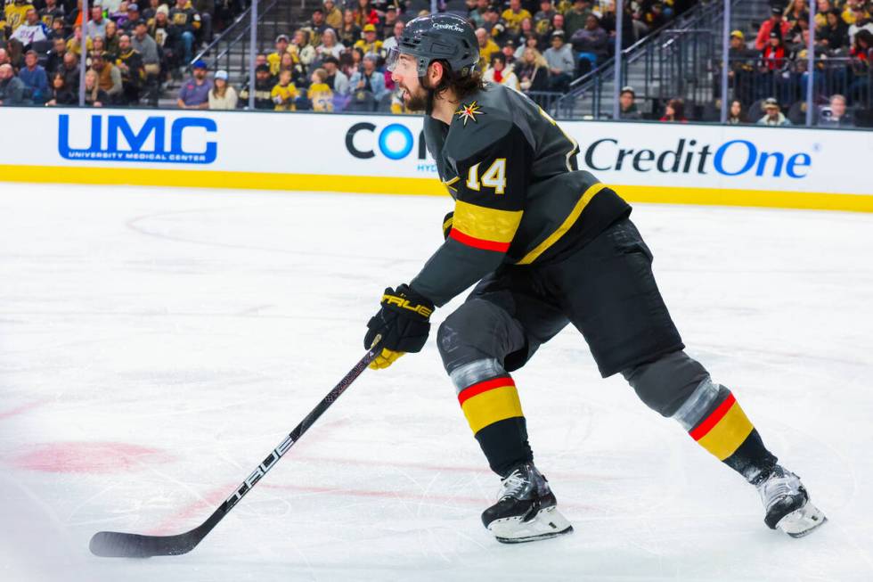 Golden Knights defenseman Nicolas Hague (14) heads back down the ice during an NHL hockey game ...