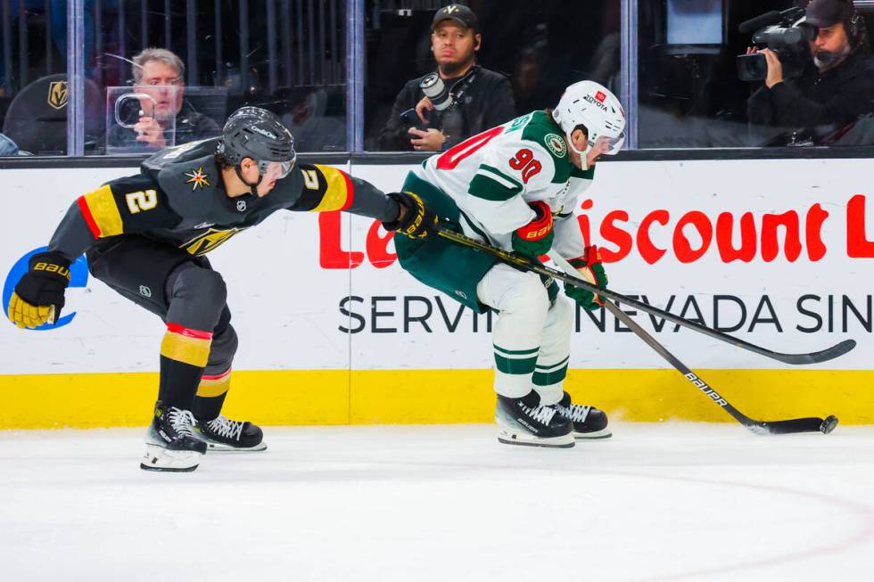 Minnesota Wild center Marcus Johansson (90) moves the puck as Golden Knights defenseman Zach Wh ...