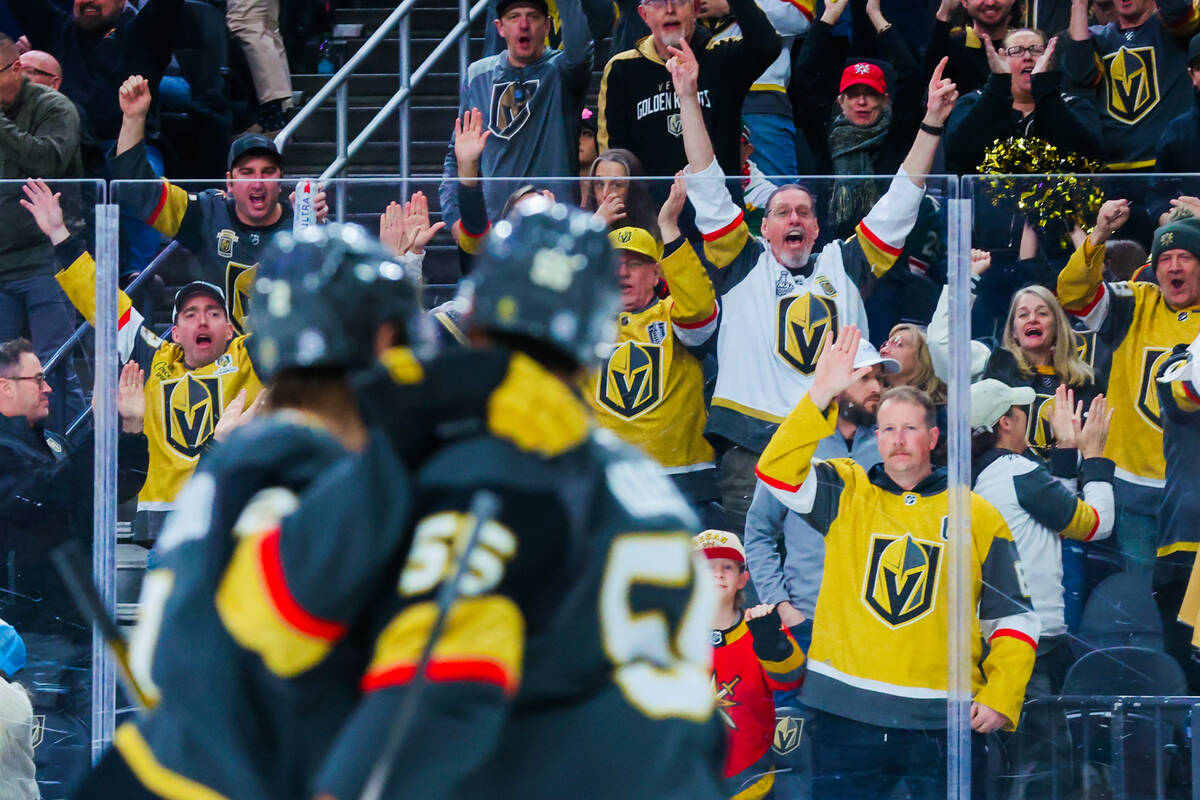 Golden Knights fans celebrate a goal during an NHL hockey game between the Golden Knights and M ...