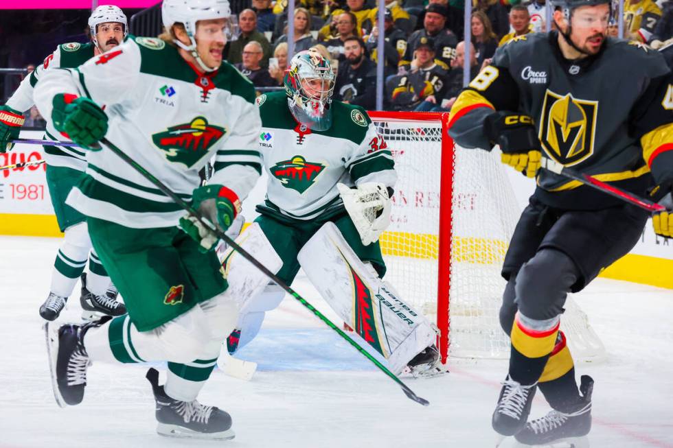 Minnesota Wild goaltender Filip Gustavsson (32) eyes the net during an NHL hockey game between ...