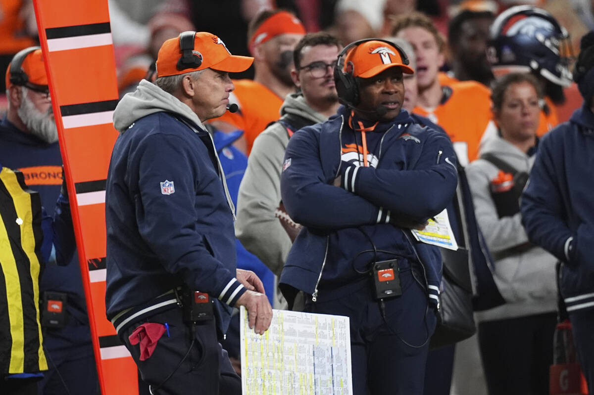 Denver Broncos head coach Sean Payton () and defensive coordinator Vance Joseph () in the secon ...