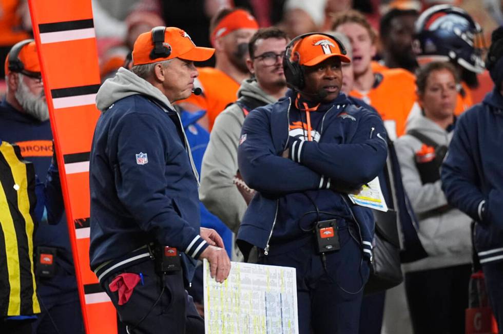 Denver Broncos head coach Sean Payton () and defensive coordinator Vance Joseph () in the secon ...