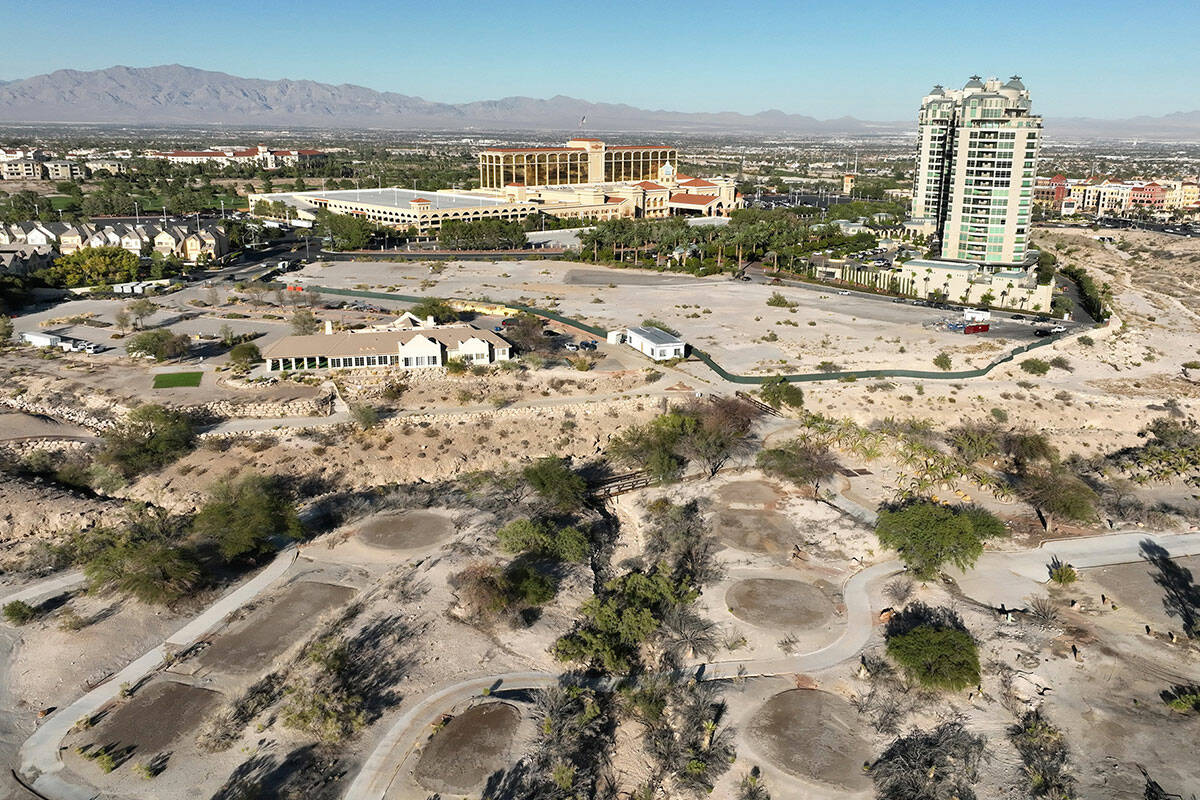 An aerial view of the shuttered Badlands Golf Course and the Queensridge towers, right, on Tues ...