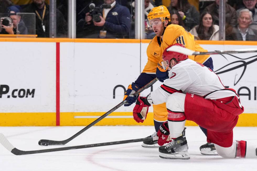 Nashville Predators center Jonathan Marchessault (81) skates the puck past Carolina Hurricanes ...