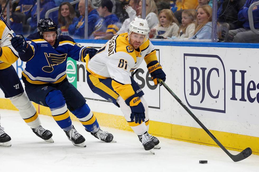 Nashville Predators' Jonathan Marchessault (81) vies for control of the puck while under pressu ...