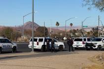 Police investigate a shooting that injured an officer and a suspect Monday, Jan. 13, 2025, in t ...