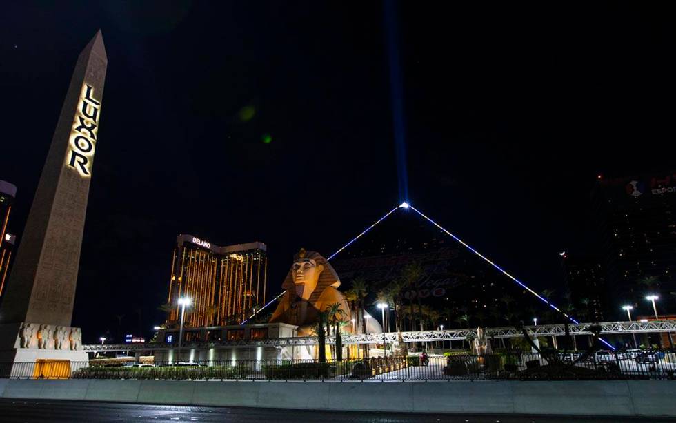 The Luxor illuminates with yellow and blue colors in support of Ukraine on Sunday, March 6, 202 ...