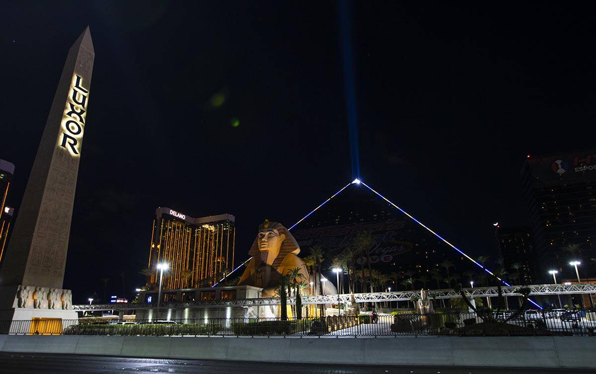 The Luxor illuminates with yellow and blue colors in support of Ukraine on Sunday, March 6, 202 ...