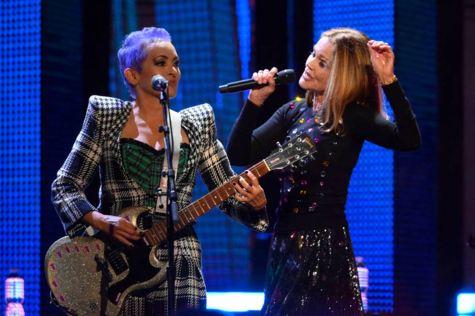 Jane Wiedlin, left, and Belinda Carlisle of the Go-Go's perform during the Rock & Roll Hall of ...