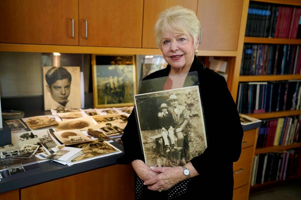 Diane Capone holds a copy of a photograph of her father, Albert "Sonny" Capone as a young boy a ...