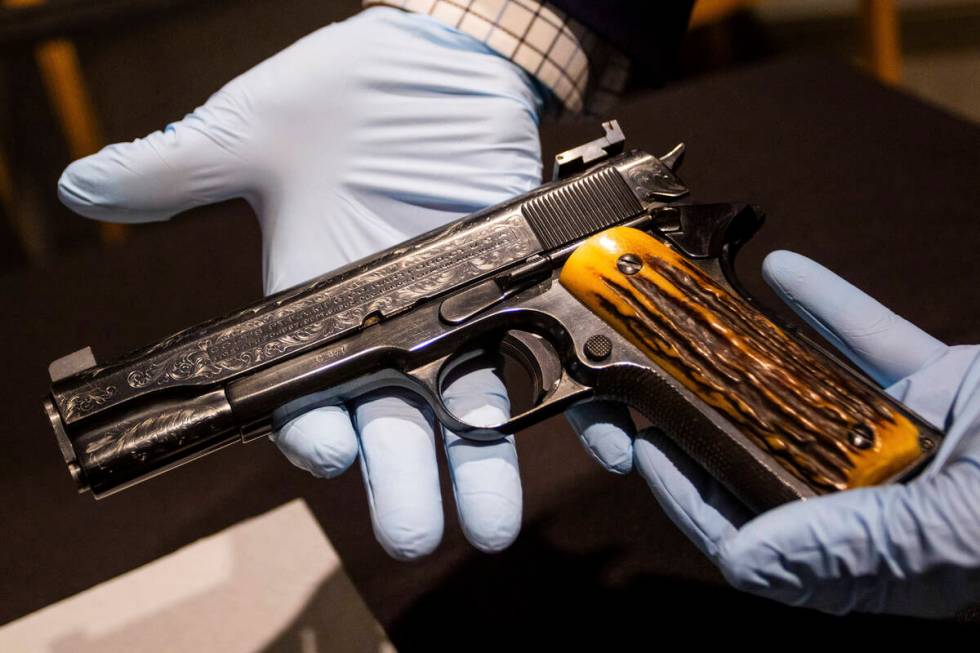 This photo taken Monday, Dec. 23, 2024, in Las Vegas shows a Colt .45-caliber pistol that once ...