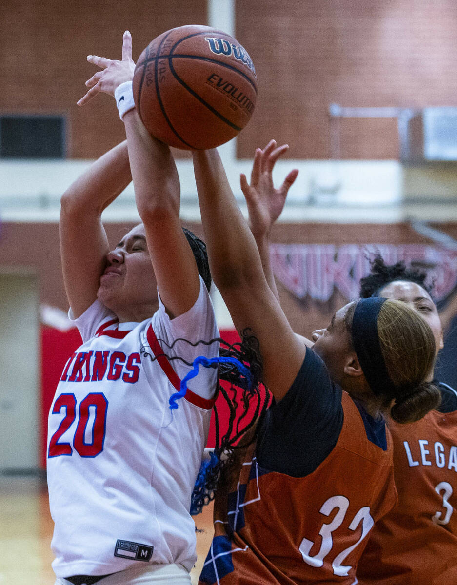 Valley's Jennifer Hughes (20) has the ball slapped away by Legacy's Ajalee Williams (32) during ...