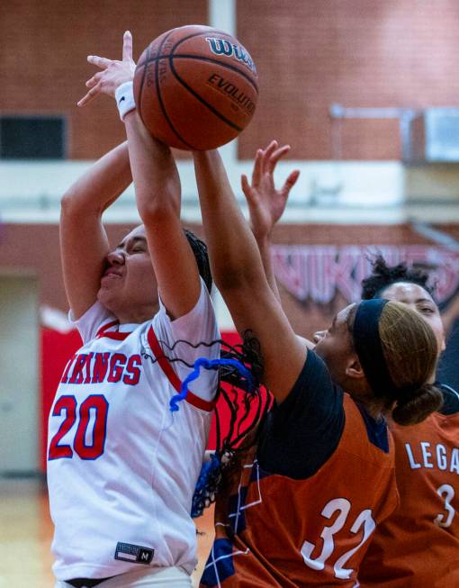 Valley's Jennifer Hughes (20) has the ball slapped away by Legacy's Ajalee Williams (32) during ...