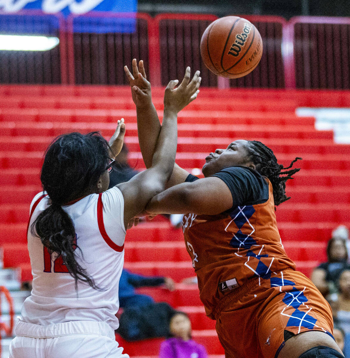 Valley's Monica Wion (12) battles for a rebound against Legacy's Iyanais Vincent (34) during th ...