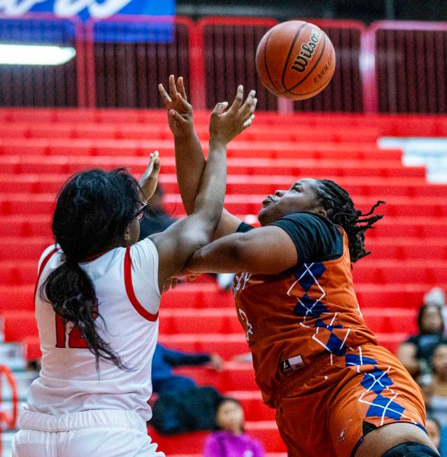 Valley's Monica Wion (12) battles for a rebound against Legacy's Iyanais Vincent (34) during th ...