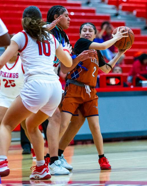 Legacy's Shalena Mesiona (2) keeps the ball from Valley's Jennifer Hughes (20) and Quinn Steidl ...