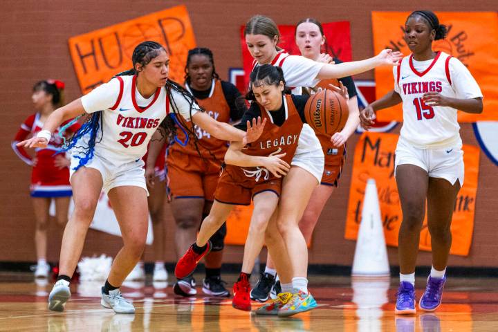 Legacy's Shalena Mesiona (2) battles to get up the court with tough defense by Valley's Jennife ...