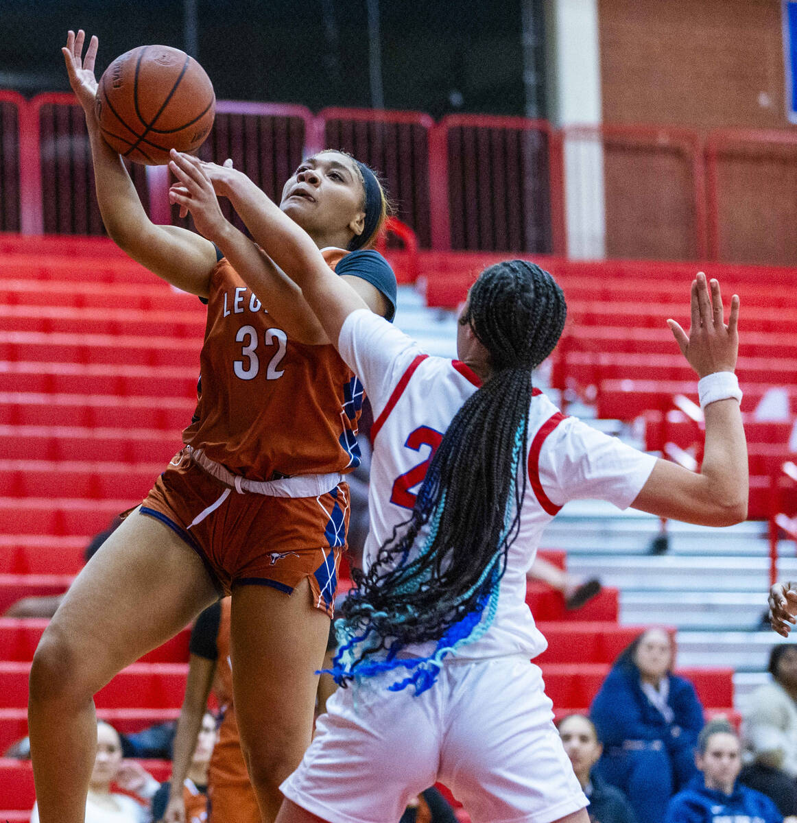 Legacy's Ajalee Williams (32) has the ball poked away by Valley's Jennifer Hughes (20) during t ...