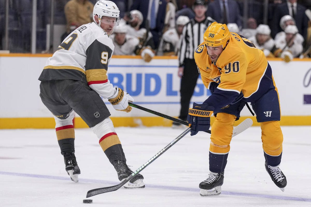 Nashville Predators center Ryan O'Reilly (90) passes the puck away from Vegas Golden Knights ce ...