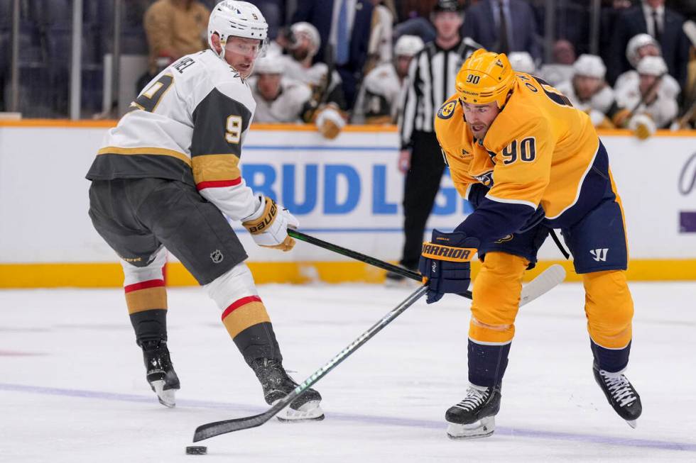 Nashville Predators center Ryan O'Reilly (90) passes the puck away from Vegas Golden Knights ce ...