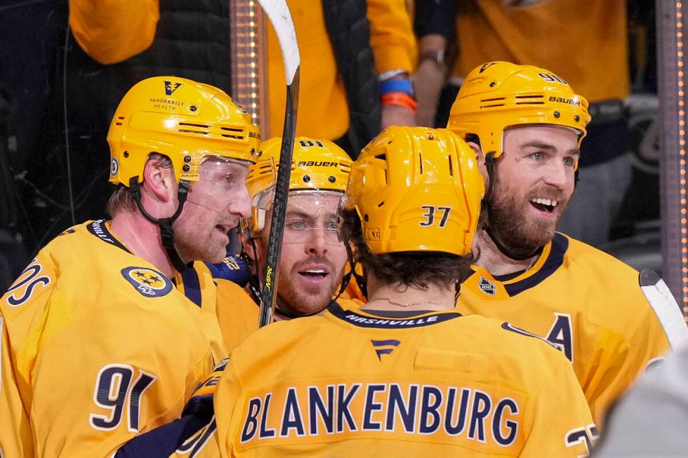 Nashville Predators center Steven Stamkos (91) celebrates his goal with teammates Jonathan Marc ...