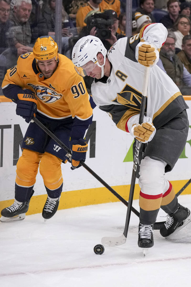 Vegas Golden Knights center Jack Eichel (9) passes the puck past Nashville Predators center Rya ...