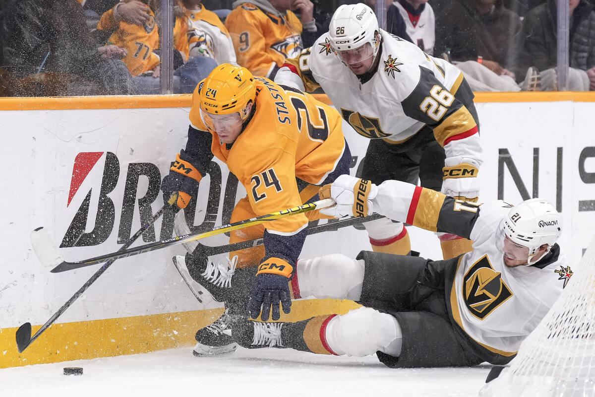 Nashville Predators defenseman Spencer Stastney (24) battles Vegas Golden Knights right wing Al ...