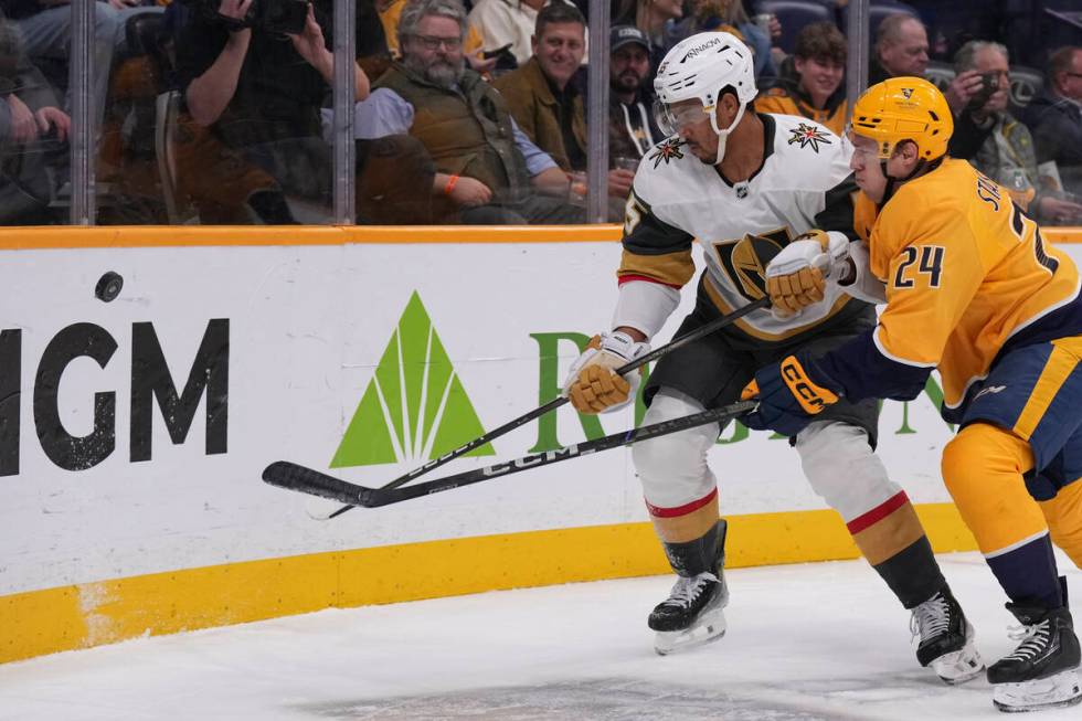 Vegas Golden Knights right wing Keegan Kolesar, left, and Nashville Predators defenseman Spence ...