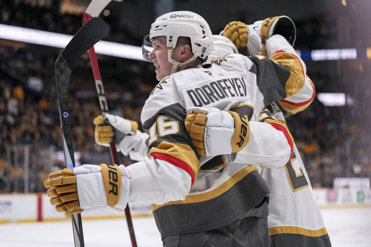 Vegas Golden Knights left wing Pavel Dorofeyev (16) celebrates his hat trick goal with teammate ...