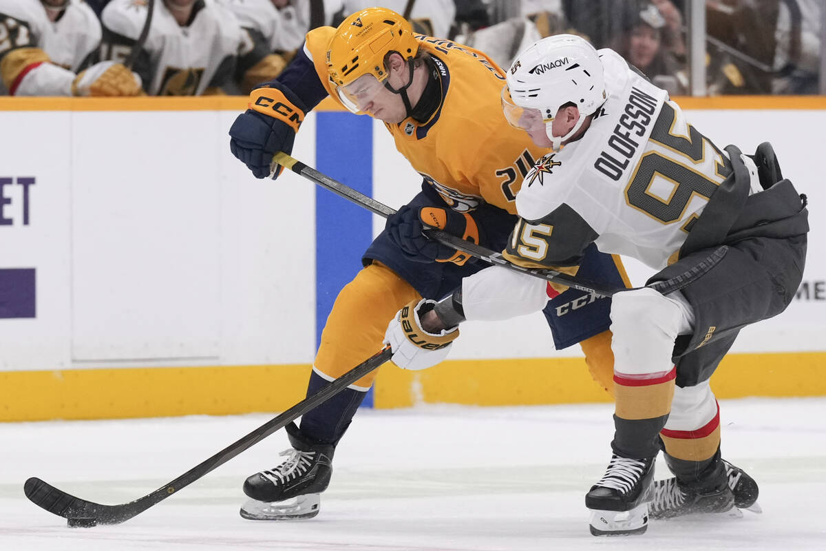 Vegas Golden Knights right wing Victor Olofsson (95) reaches for the puck past Nashville Predat ...