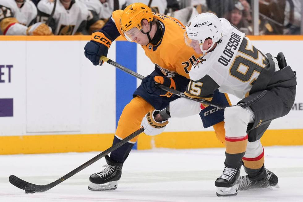 Vegas Golden Knights right wing Victor Olofsson (95) reaches for the puck past Nashville Predat ...