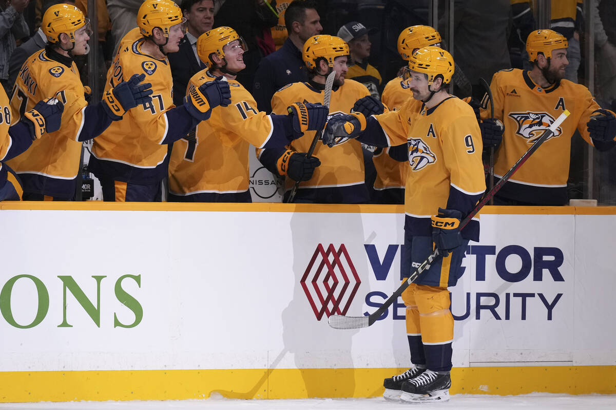 Nashville Predators left wing Filip Forsberg (9) celebrates his goal with teammates during the ...