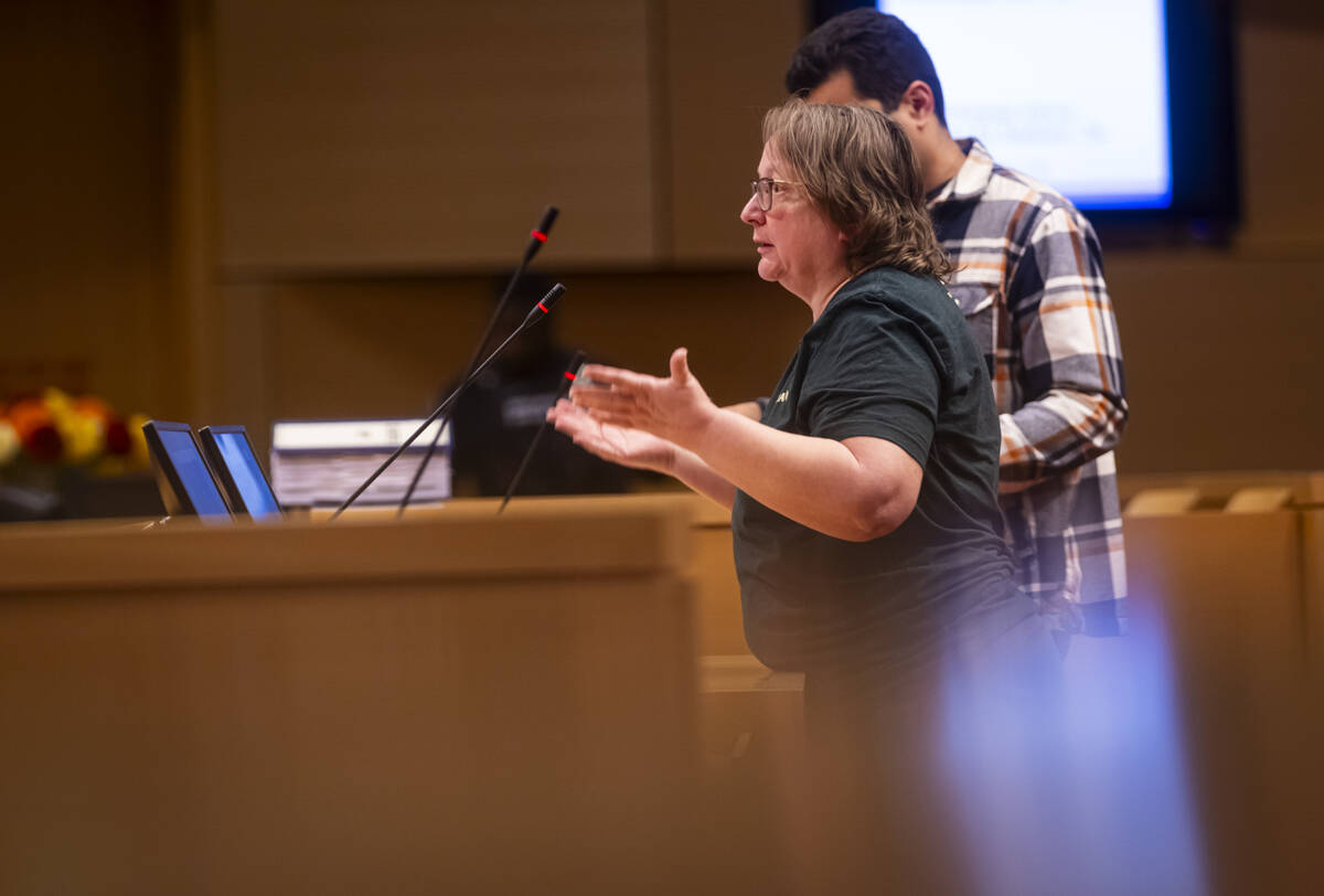 Julie Slack speaks against a proposed housing development at the former Badlands golf course du ...