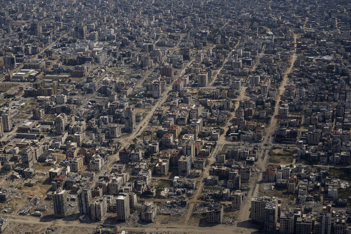 Destroyed buildings are seen through the window of an airplane from the U.S. Air Force overflyi ...