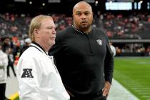 Las Vegas Raiders Head Coach Antonio Pierce, right, and owner Mark Davis talk prior to an NFL f ...