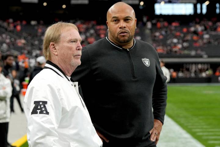 Las Vegas Raiders Head Coach Antonio Pierce, right, and owner Mark Davis talk prior to an NFL f ...