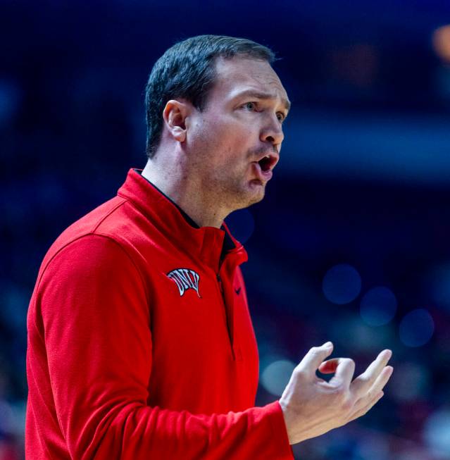 UNLV head coach Kevin Kruger argues a foul call for the Utah State Aggies during the first half ...