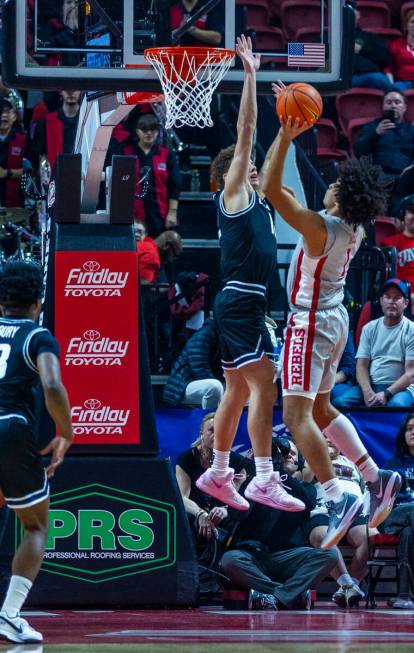 UNLV forward Jalen Hill (1) sets up to shoot over Utah State Aggies guard Mason Falslev (12) du ...