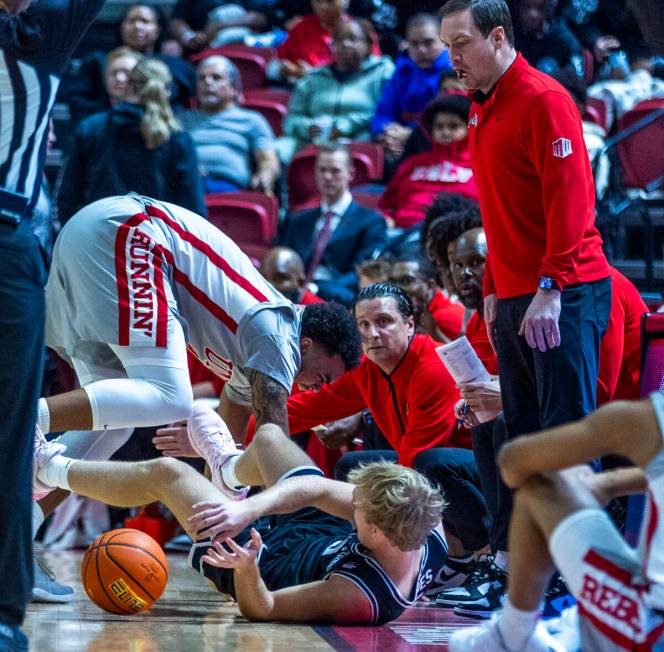 UNLV forward Jeremiah Cherry (45) collides with Utah State Aggies forward Karson Templin (22) a ...