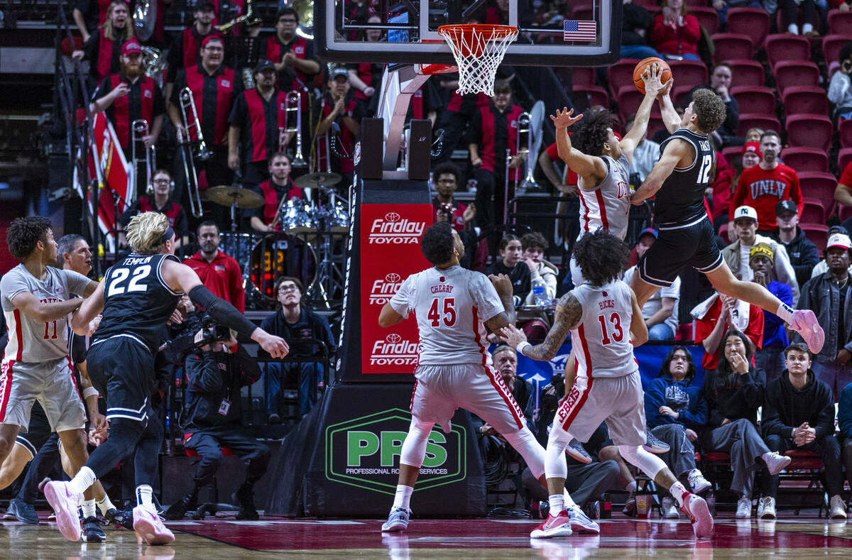 UNLV forward Jalen Hill (1) blocks a shot attempt by Utah State Aggies guard Mason Falslev (12) ...